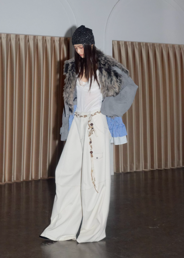 korean street jacket, faux fur collar jacket women, detachable hem jacket, hybrid layered jacket, matte grey PU leather coat, nomadic street style jacket, JNYLON outerwear, fake two piece jacket women, urban grunge fashion, deconstructed winter jacket, asymmetrical hem coat, korean edgy fashion, layered PU leather jacket, faux fur grey jacket women
