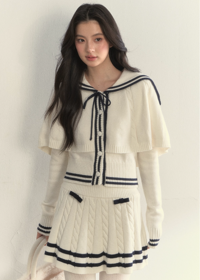 SunsetPark knit set, navy collar knit cape, vintage sailor outfit, twist knit sweater set, winter pleated skirt set, feminine old-fashioned style, cozy Korean winter knit, cream sailor knit top, navy trim pleated skirt, romantic winter outfit, girly vintage knitwear, classic sailor collar set, AW Korean fashion set