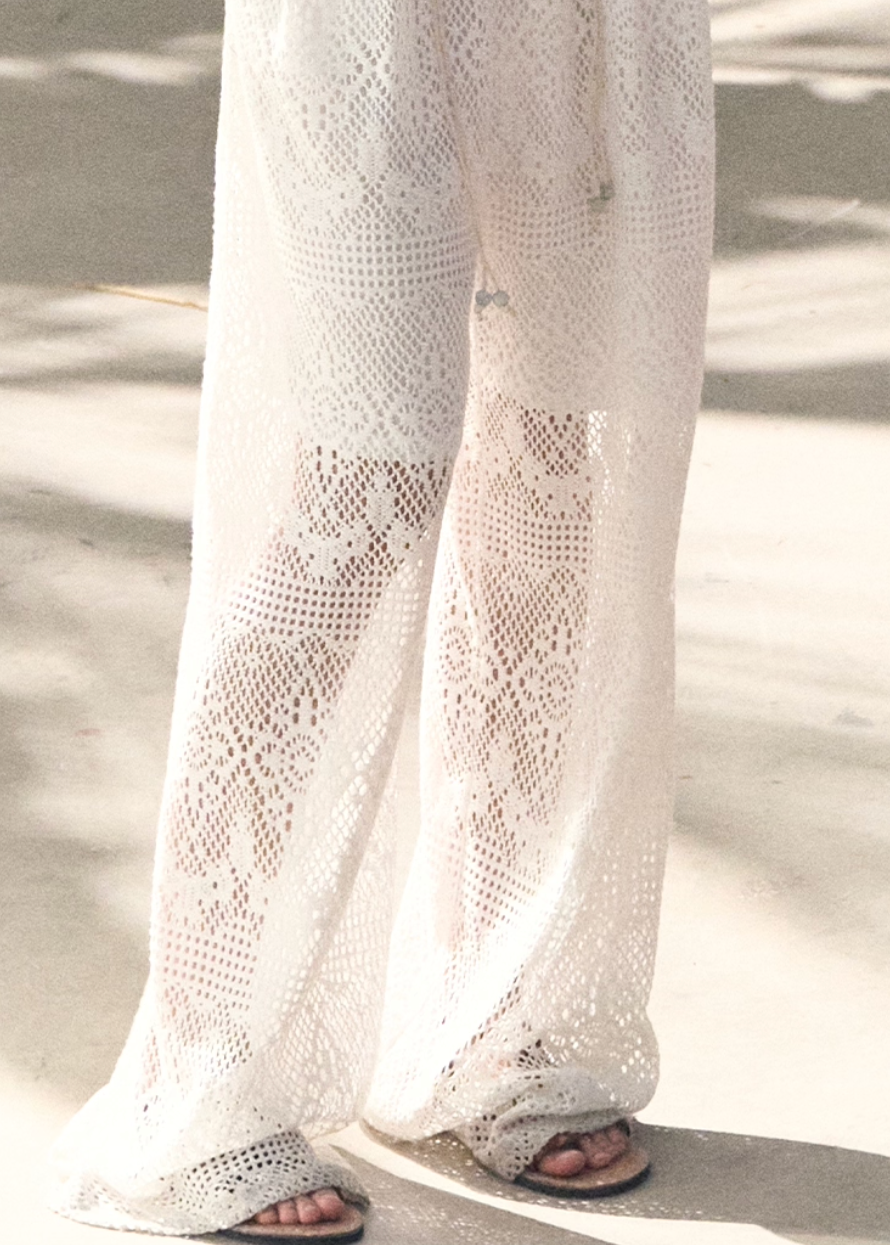 crochet lace pants women, cutout lace slacks, breathable summer pants, korean minimal trousers, wide leg lace pants, lightweight women pants, elegant summer bottoms, modern feminine pants, airy lace trousers, premium crochet pants, resort style pants women, spring summer slacks, versatile lace pants, oakmoo pants style, refined casual bottoms