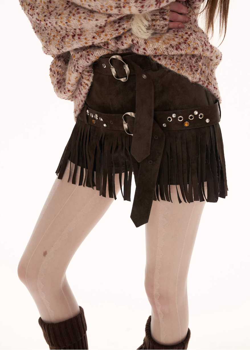 suede fringe shorts women, western style shorts women, y2k mini shorts, high fashion suede shorts, brown fringe shorts, street style shorts women, autumn winter fashion shorts, statement mini slacks, trendy suede bottoms, mamc shorts style, unique design shorts, fringe detail shorts, y2k streetwear women, premium women shorts, fashion western shorts