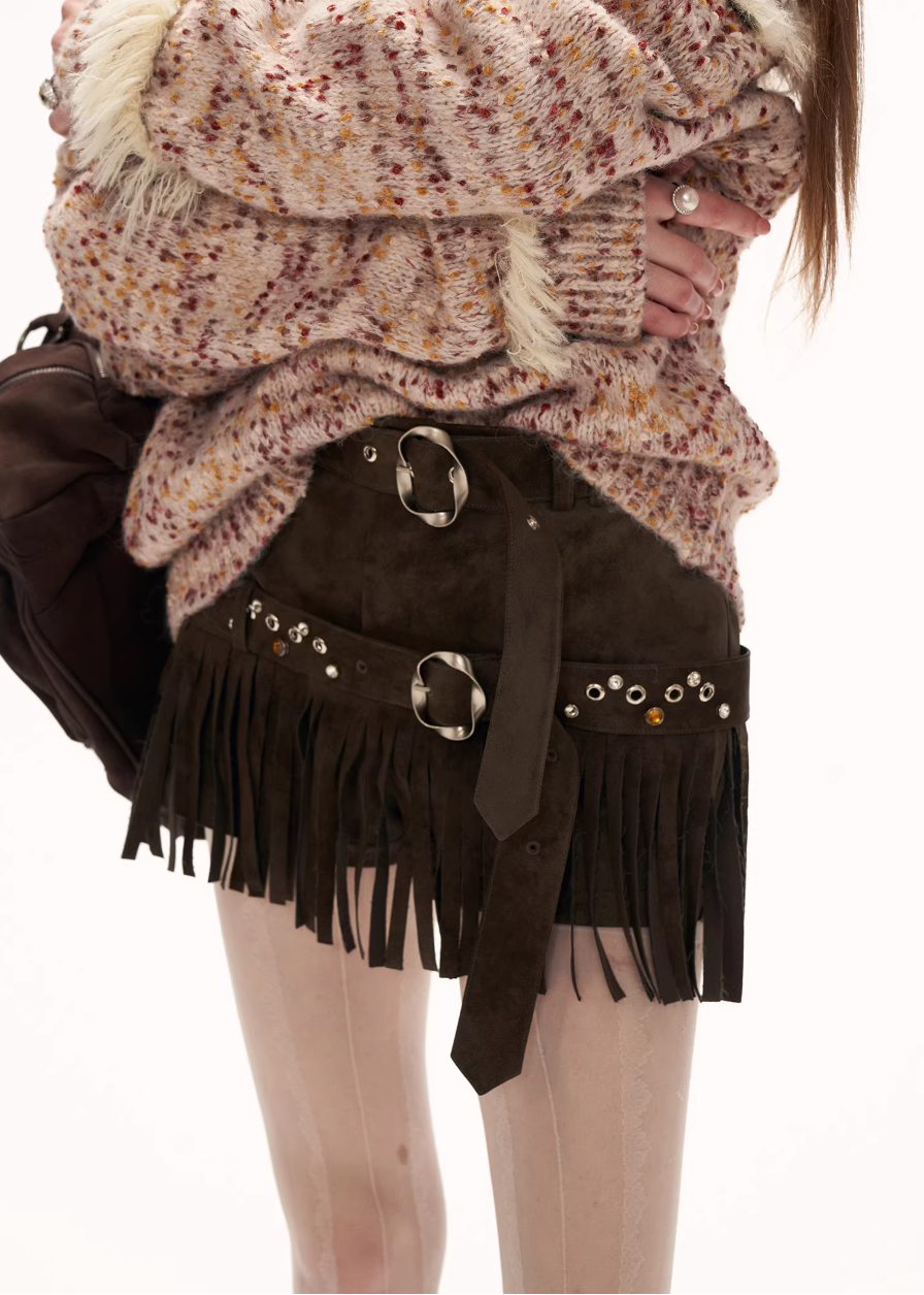 suede fringe shorts women, western style shorts women, y2k mini shorts, high fashion suede shorts, brown fringe shorts, street style shorts women, autumn winter fashion shorts, statement mini slacks, trendy suede bottoms, mamc shorts style, unique design shorts, fringe detail shorts, y2k streetwear women, premium women shorts, fashion western shorts