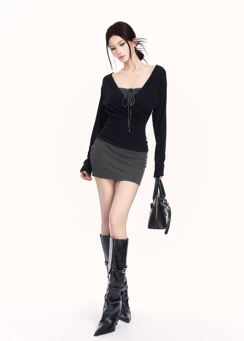 black gray knit set women, two piece knit skirt set, edgy slim fit outfit, v neck knit top women, bodycon skirt set women, dark minimalist fashion, vock set style, urban women knitwear, waist shaping knit set, alternative street fashion women, modern black outfit women, controlled silhouette clothing, edgy spring knit set, slim fit knitwear women, minimalist street set