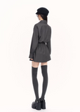 trench style mini dress women, pleated waist dress, british college dress women, edgy commuter dress, lapel mini dress women, dark minimalist fashion dress, vock dress style, tailored spring dress women, urban preppy dress, waist shaping mini dress, alternative office wear women, structured pleated dress, modern black gray dress, controlled silhouette fashion, early spring women dress