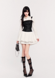 suspender mini dress women, corset waist dress, pleated puff skirt dress, edgy princess style dress, black white mini dress, vock dress style, waist slimming party dress, alternative fashion mini dress, structured suspender dress, dark romantic fashion, statement birthday dress women, controlled silhouette clothing, modern gothic mini dress, edgy valentine dress women, fashion puff skirt dress
