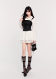 suspender mini dress women, corset waist dress, pleated puff skirt dress, edgy princess style dress, black white mini dress, vock dress style, waist slimming party dress, alternative fashion mini dress, structured suspender dress, dark romantic fashion, statement birthday dress women, controlled silhouette clothing, modern gothic mini dress, edgy valentine dress women, fashion puff skirt dress