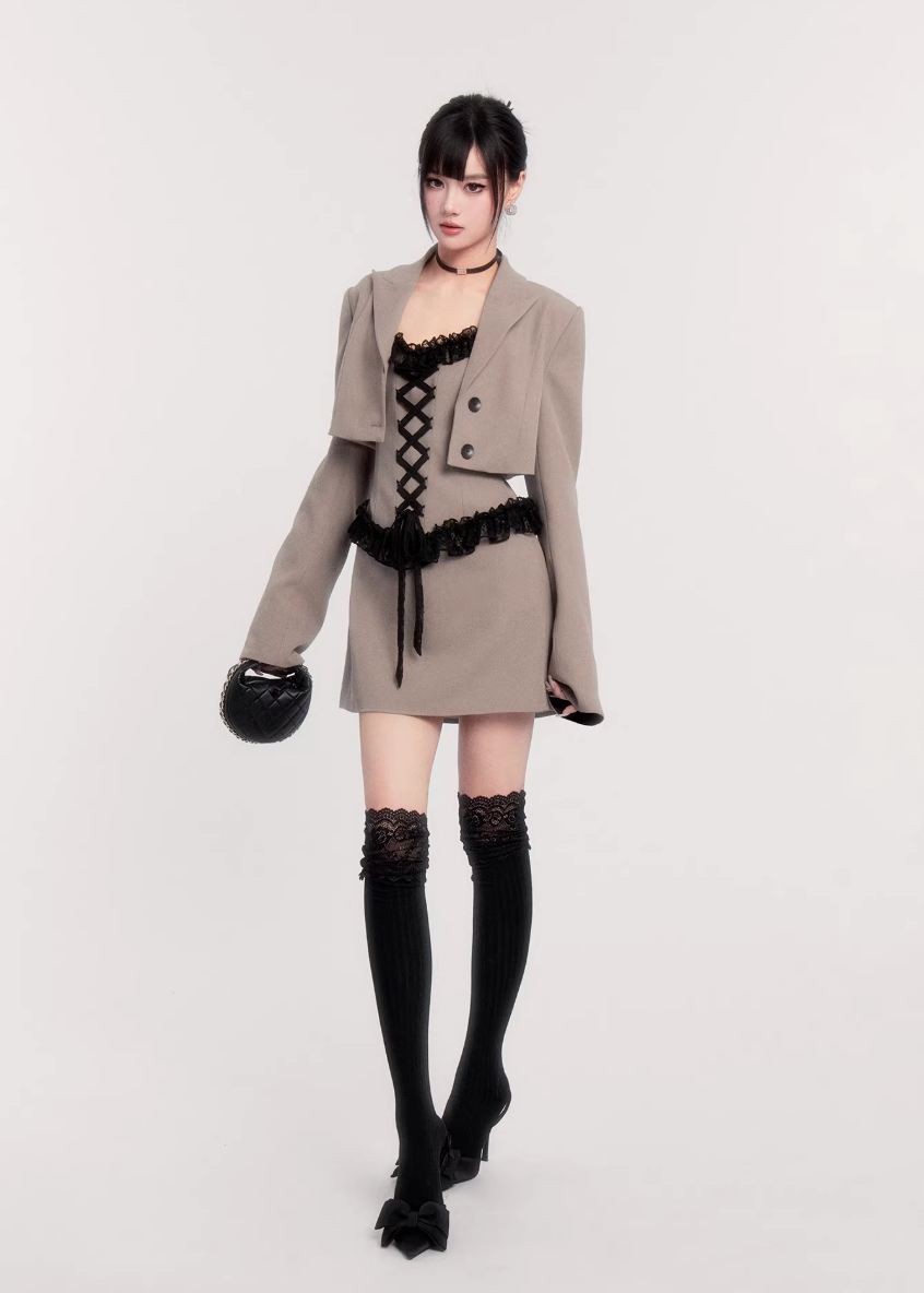 two piece blazer dress women, lace panel mini dress, cropped blazer set women, edgy tailored outfit, vock two piece set, waist defining mini dress, dark minimalist fashion women, structured blazer mini dress, alternative fashion set women, modern street tailoring, controlled silhouette clothing, edgy spring outfit women, contrast texture dress set, statement women suit set, urban luxury womenswear
