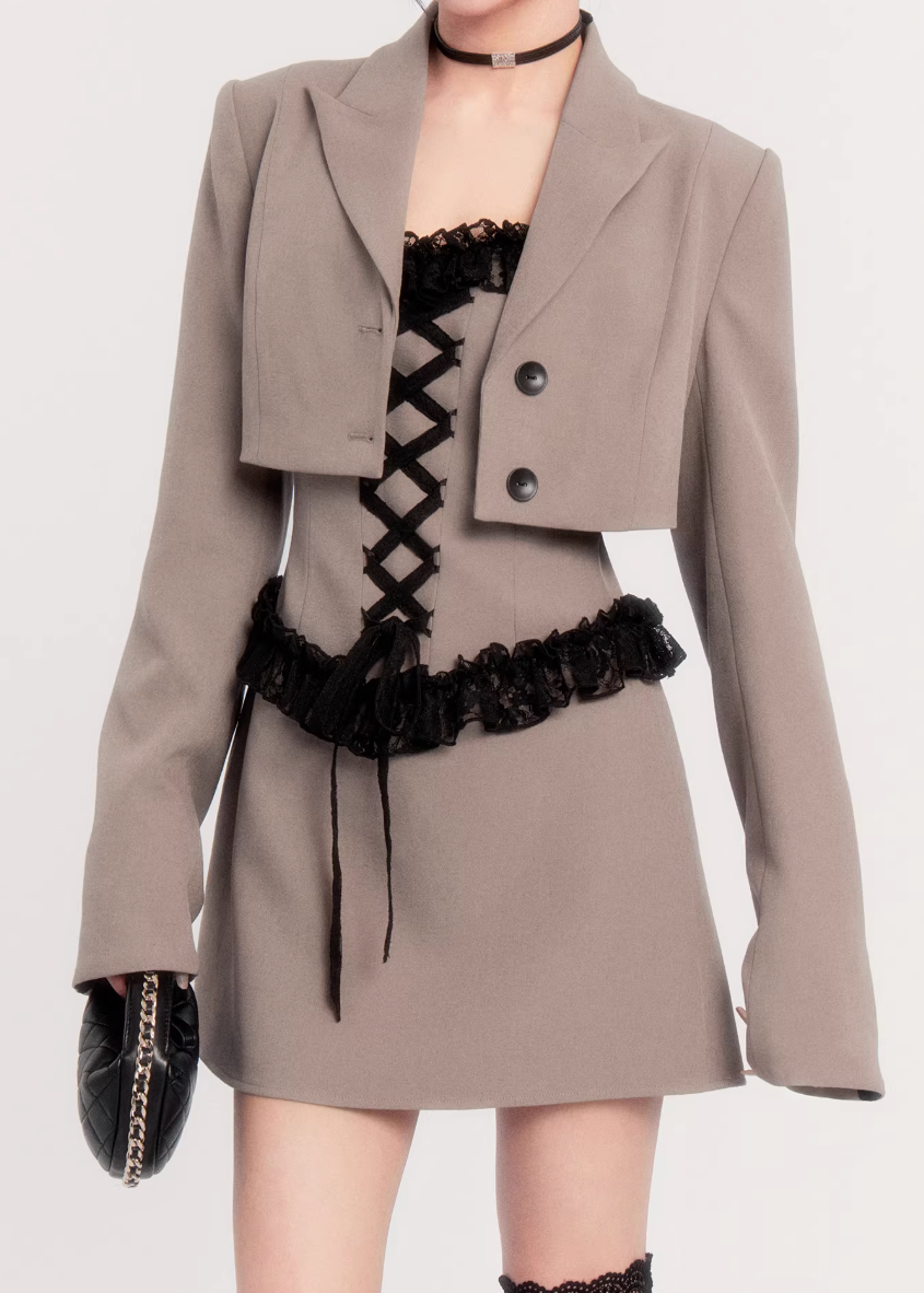 two piece blazer dress women, lace panel mini dress, cropped blazer set women, edgy tailored outfit, vock two piece set, waist defining mini dress, dark minimalist fashion women, structured blazer mini dress, alternative fashion set women, modern street tailoring, controlled silhouette clothing, edgy spring outfit women, contrast texture dress set, statement women suit set, urban luxury womenswear