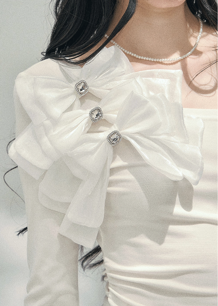 off shoulder long sleeve top women, bow detail spring top, slim fit t shirt women, aomalm top style, feminine spring outfit women, elegant off shoulder tee, refined casual women top, korean french style clothing, lightweight spring top women, shoulder revealing top women, modern women long sleeve tee, delicate bow top, understated luxury spring wear, hot girl spring top, versatile women fashion top
