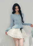 AOMALM pearl knit cardigan, French romantic cropped sweater, feminine spring knit top, Korean elegant cardigan women, pearl button knitwear, soft blush cropped cardigan, quiet luxury womens knit, ruffle hem spring sweater, romantic Korean French aesthetic clothing, delicate feminine knit top, waist defining cropped cardigan, lightweight spring knitwear women, refined pearl detail sweater, elegant pastel cardigan outfit, soft romantic womenswear knit, luxury feminine spring fashion, blush pink knit cardigan,
