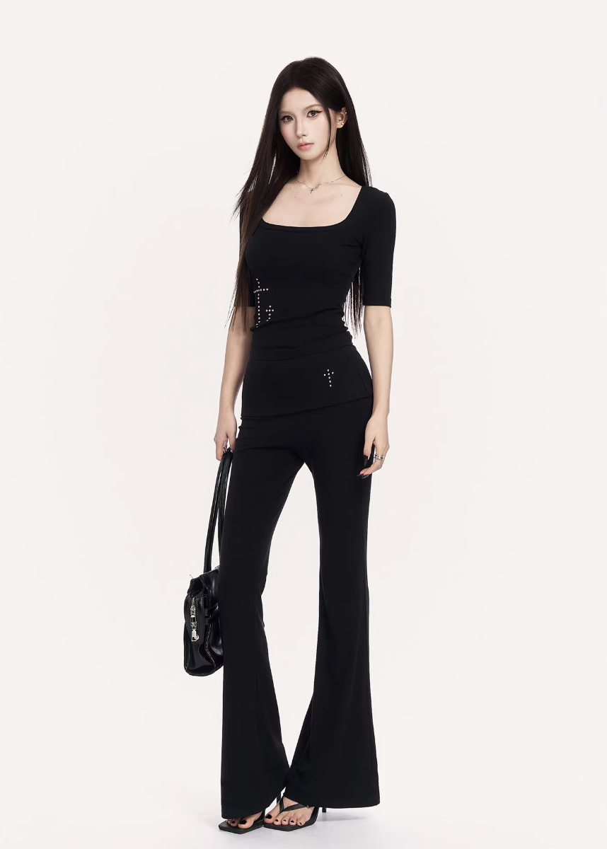 VOCK flared trousers set women, urban studded knit top, minimalist low rise flare pants, Korean street luxury outfit, cold urban aesthetic womenswear, sleek monochrome streetwear set, modern Seoul street style trousers, structured slim fit knit top, VOCK power dressing outfit, architectural silhouette streetwear, edgy minimalist flare pants women, urban fitted T-shirt set, clean line street fashion ensemble