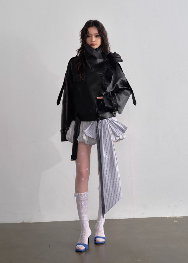 JNYLON faux leather jacket women, Korean stylish leather outerwear, stand collar PU jacket Korean fashion, edgy ruffle leather jacket women, modern Korean street chic jacket, oversized faux leather biker jacket women, trendy Korean fashion outerwear, playful structured leather jacket, chic Korean style faux leather coat, statement urban fashion jacket women