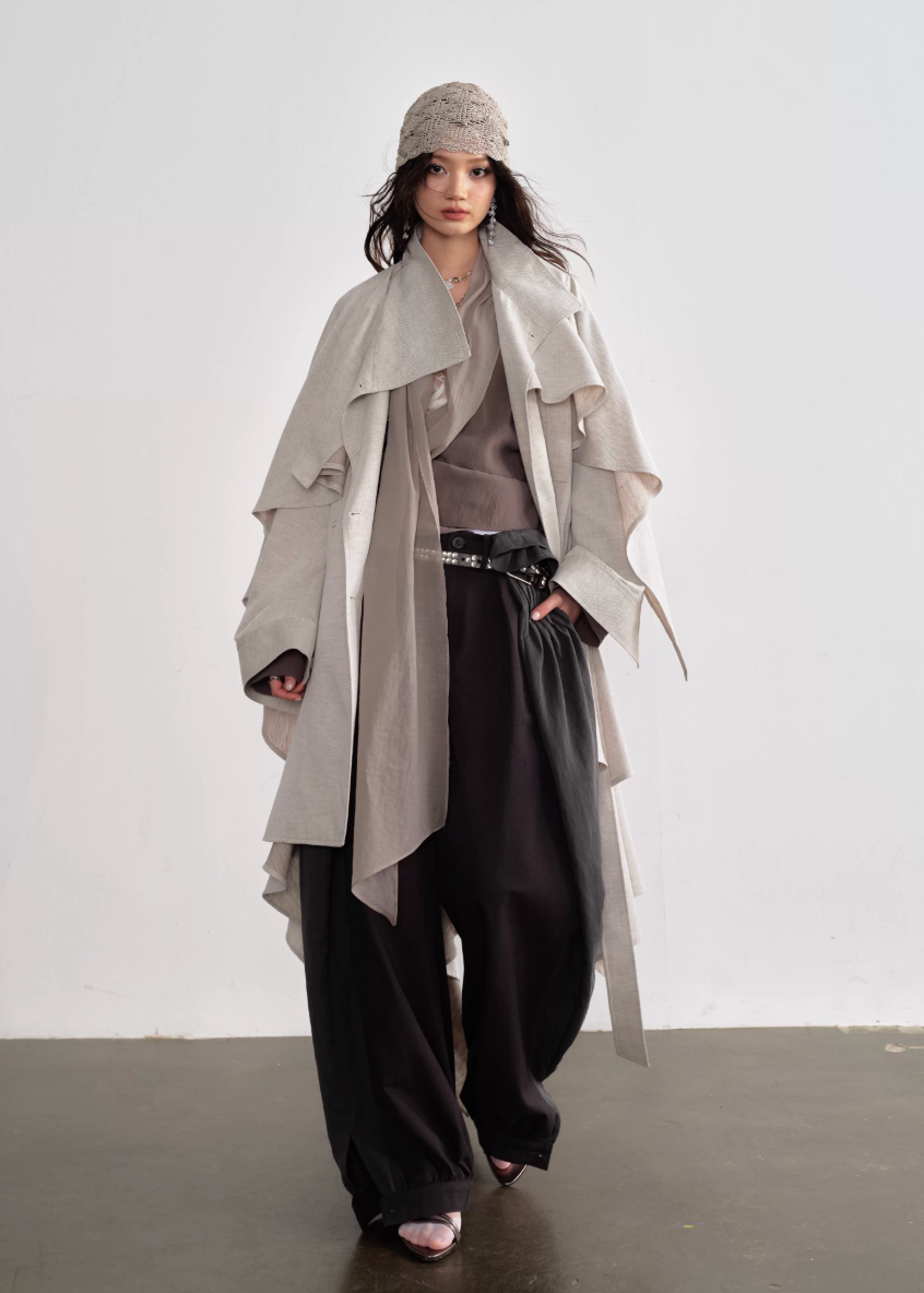 JNYLON detachable cape trench coat women, Korean stylish linen trench coat, modern Korean fashion long coat, chic natural style outerwear women, trendy Korean street chic trench, plaster white irregular trench coat, oversized linen blend coat Korean style, urban fashion layered trench women, stylish Korean aesthetic long coat, fashionable natural tone trench coat