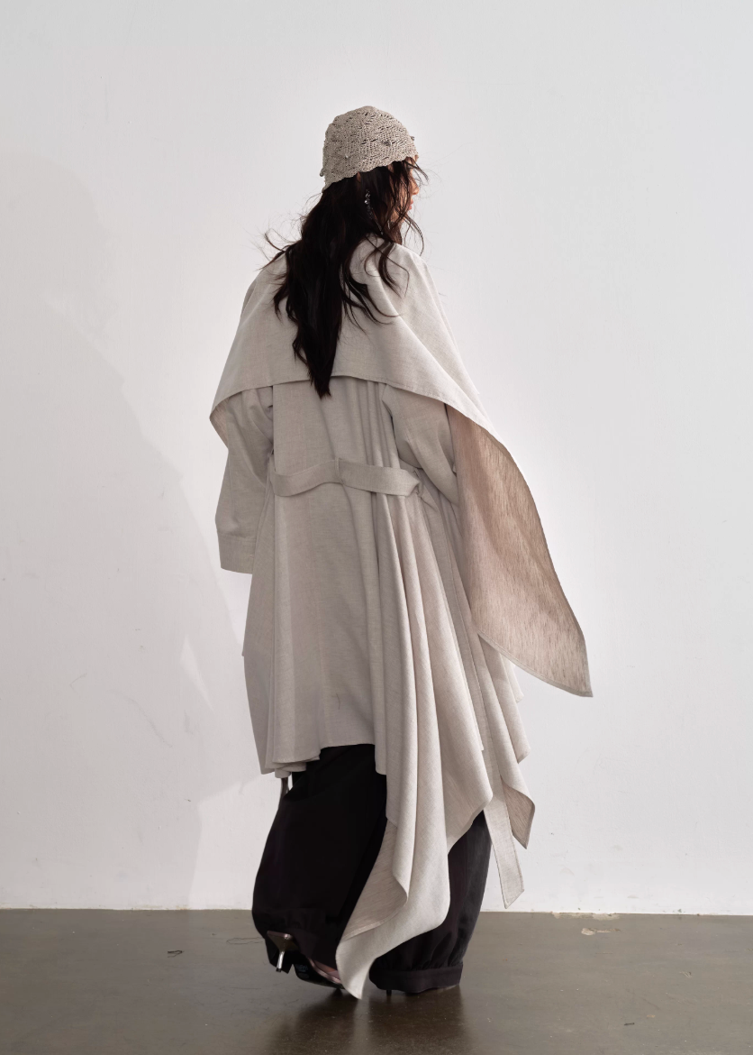 JNYLON detachable cape trench coat women, Korean stylish linen trench coat, modern Korean fashion long coat, chic natural style outerwear women, trendy Korean street chic trench, plaster white irregular trench coat, oversized linen blend coat Korean style, urban fashion layered trench women, stylish Korean aesthetic long coat, fashionable natural tone trench coat