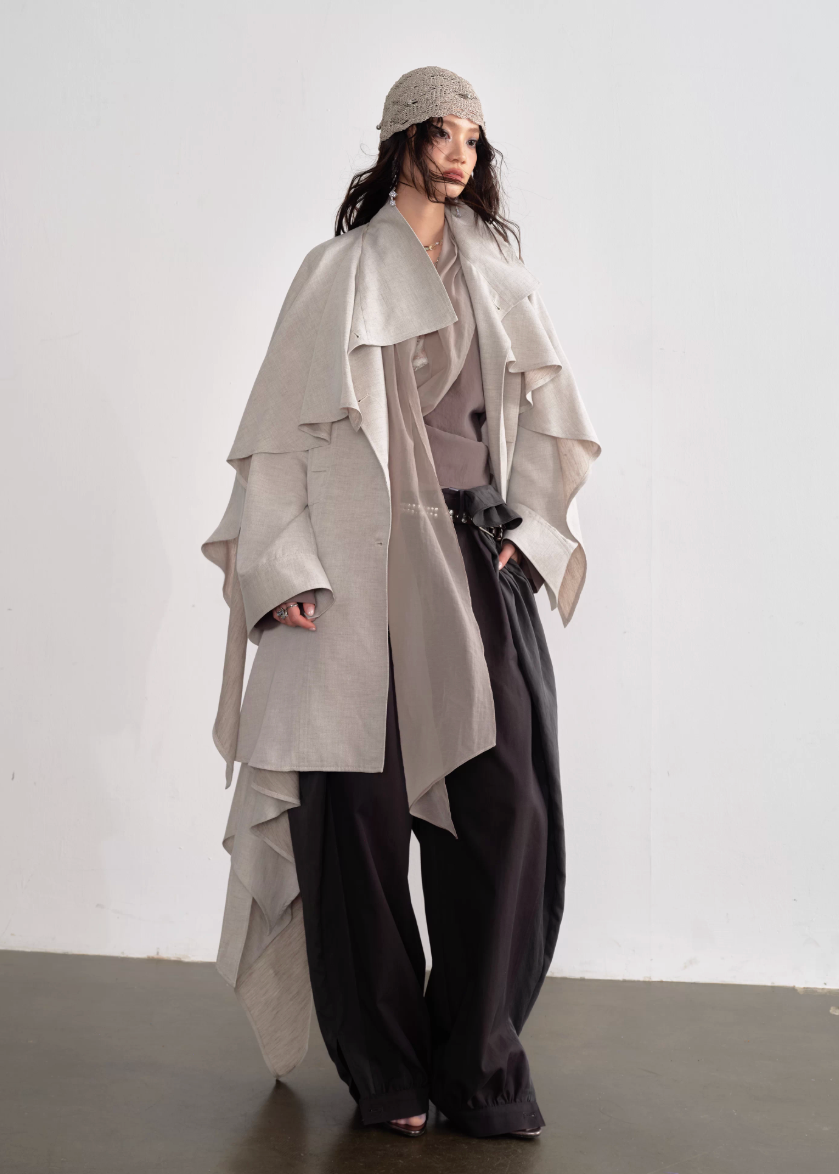 JNYLON detachable cape trench coat women, Korean stylish linen trench coat, modern Korean fashion long coat, chic natural style outerwear women, trendy Korean street chic trench, plaster white irregular trench coat, oversized linen blend coat Korean style, urban fashion layered trench women, stylish Korean aesthetic long coat, fashionable natural tone trench coat