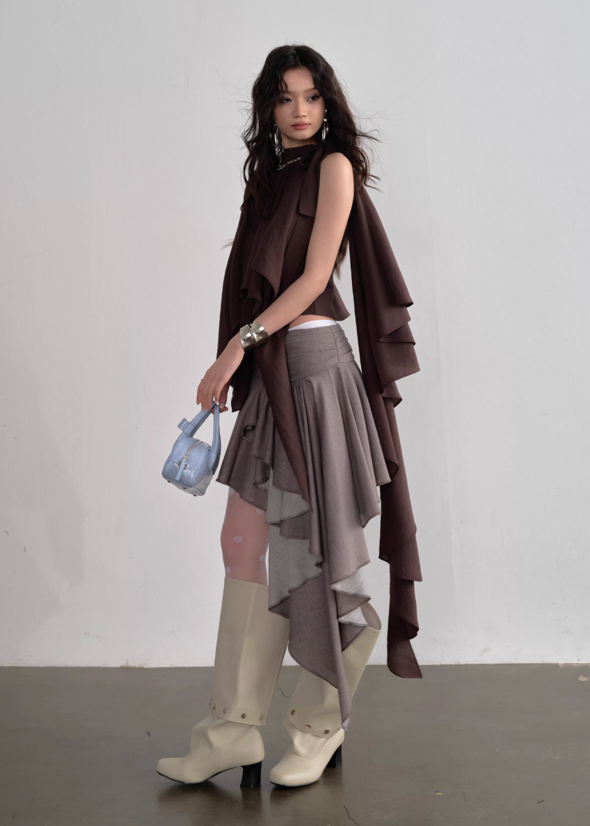 JNYLON pleated linen skirt women, Korean stylish asymmetric skirt, modern Korean fashion layered skirt, chic retro romantic pleated skirt women, trendy Korean street chic outfit, linen blend irregular skirt Korean style, lightweight pleated fashion skirt women, urban fashion asymmetric skirt, stylish Korean aesthetic skirt, fashionable natural tone pleated skirt