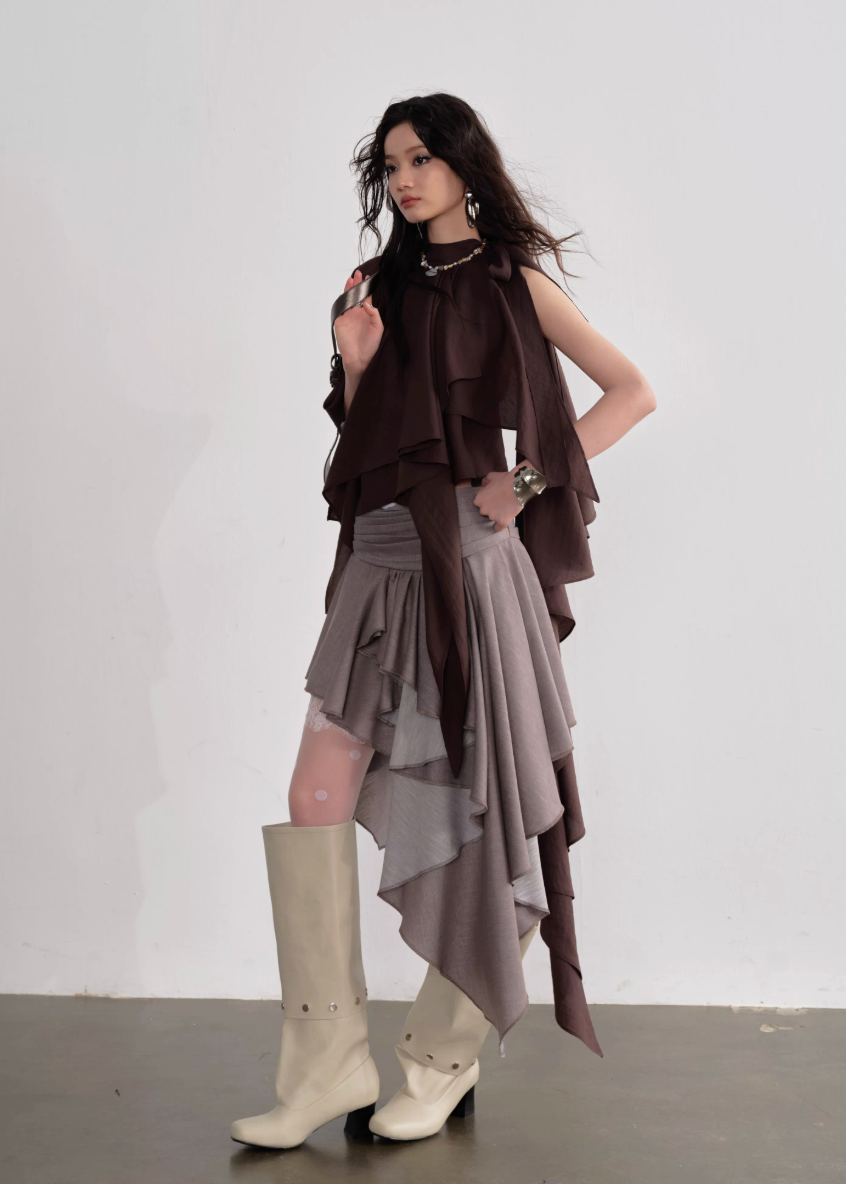 JNYLON pleated linen skirt women, Korean stylish asymmetric skirt, modern Korean fashion layered skirt, chic retro romantic pleated skirt women, trendy Korean street chic outfit, linen blend irregular skirt Korean style, lightweight pleated fashion skirt women, urban fashion asymmetric skirt, stylish Korean aesthetic skirt, fashionable natural tone pleated skirt