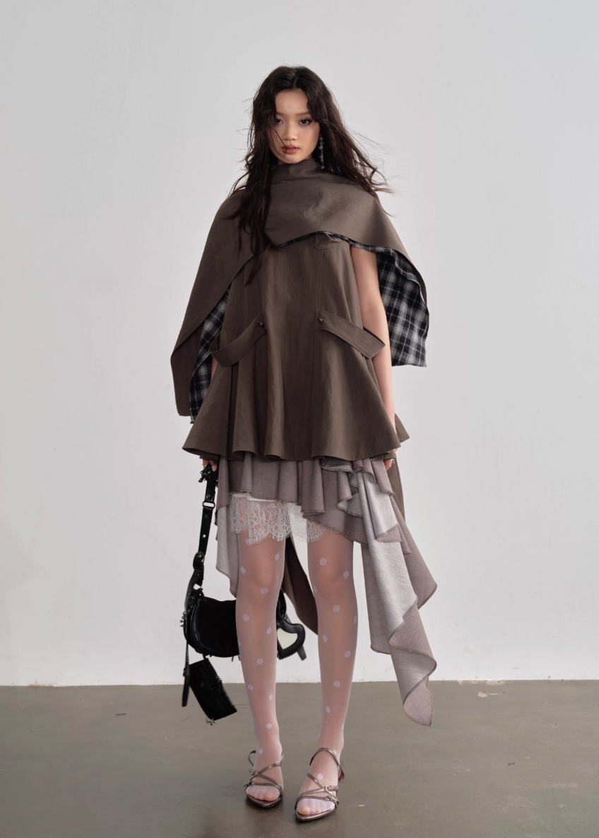 JNYLON pleated linen skirt women, Korean stylish asymmetric skirt, modern Korean fashion layered skirt, chic retro romantic pleated skirt women, trendy Korean street chic outfit, linen blend irregular skirt Korean style, lightweight pleated fashion skirt women, urban fashion asymmetric skirt, stylish Korean aesthetic skirt, fashionable natural tone pleated skirt