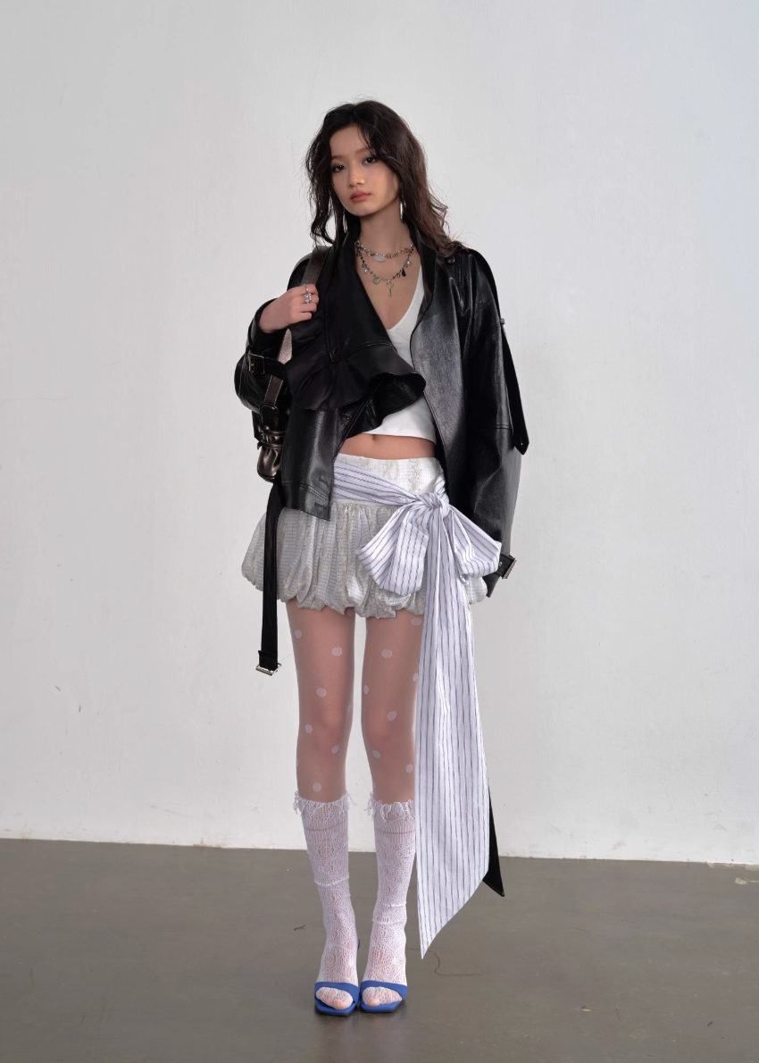 JNYLON ballet style mini skirt, Korean stylish puffy skirt, embroidered bow lace-up skirt women, playful age-reducing skirt Korean fashion, chic Korean street mini skirt, modern Korean fashion puffy skirt, trendy ribbon detail skirt women, lightweight layered mini skirt, urban ballet inspired skirt, fashionable Korean aesthetic skirt women