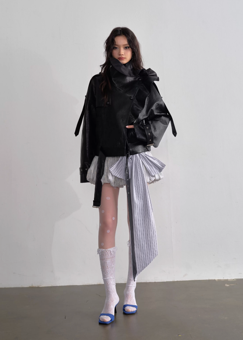 JNYLON ballet style mini skirt, Korean stylish puffy skirt, embroidered bow lace-up skirt women, playful age-reducing skirt Korean fashion, chic Korean street mini skirt, modern Korean fashion puffy skirt, trendy ribbon detail skirt women, lightweight layered mini skirt, urban ballet inspired skirt, fashionable Korean aesthetic skirt women