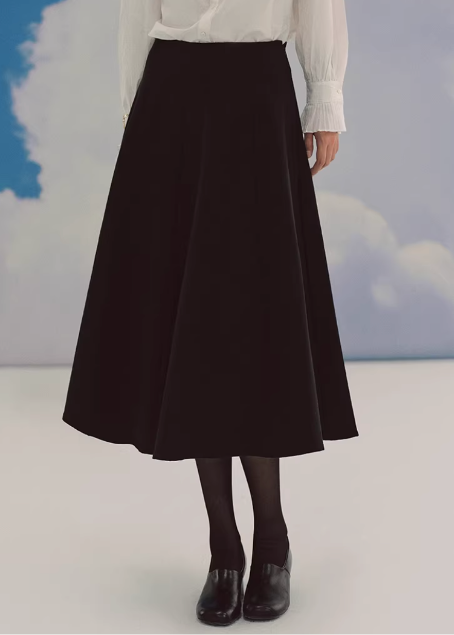 black midi skirt, pleated skirt women, a line midi skirt, umbrella skirt, elegant black skirt, korean fashion skirt, french style midi skirt, high waist skirt, minimalist skirt women, spring midi skirt, flowy skirt outfit, versatile black skirt, classic midi skirt, feminine silhouette skirt, chic pleated skirt, everyday elegant wear, parisian style clothing, soft structured skirt, refined women fashion, timeless wardrobe essential