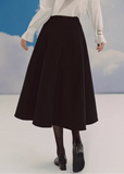 black midi skirt, pleated skirt women, a line midi skirt, umbrella skirt, elegant black skirt, korean fashion skirt, french style midi skirt, high waist skirt, minimalist skirt women, spring midi skirt, flowy skirt outfit, versatile black skirt, classic midi skirt, feminine silhouette skirt, chic pleated skirt, everyday elegant wear, parisian style clothing, soft structured skirt, refined women fashion, timeless wardrobe essential
