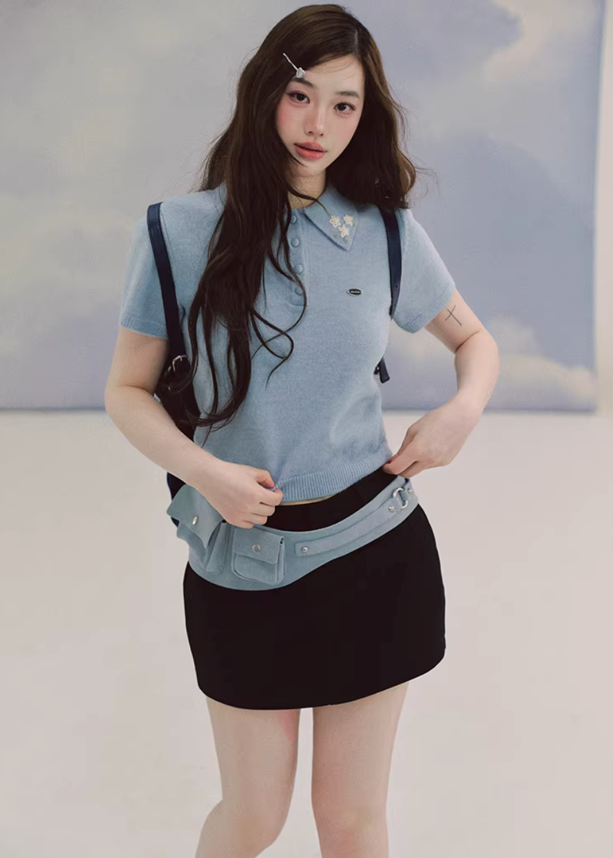 polo knit top women, embroidered sweater top, short sleeve knit, korean fashion top, fitted polo shirt women, spring knitwear, waist slimming top, elegant casual top, soft knit blouse, minimalist polo top, feminine knitwear, everyday chic outfit, blue knit top women, refined casual wear, lightweight sweater top, modern feminine clothing, versatile spring top, tailored knit shirt, aesthetic fashion top, parisian casual style
