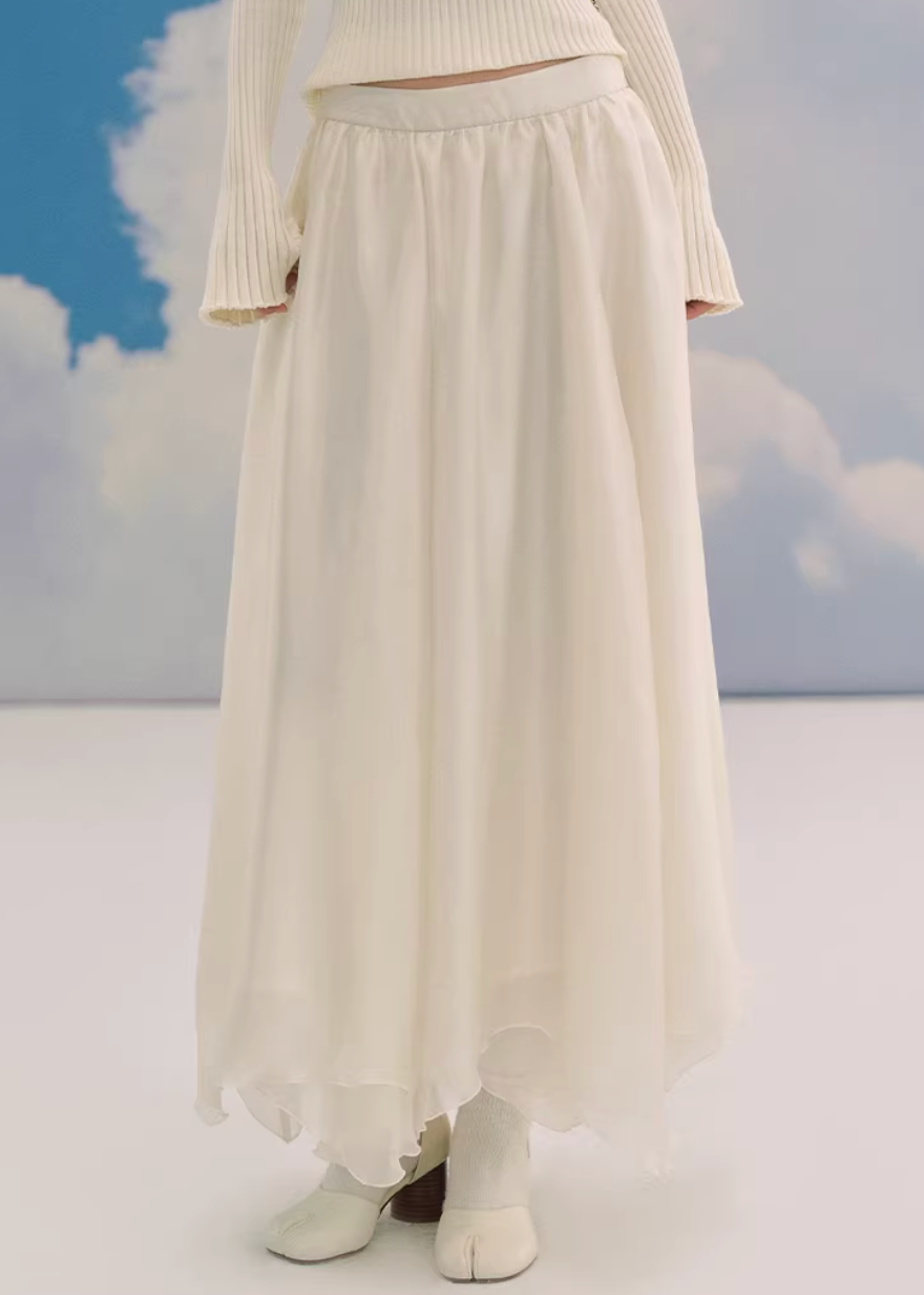 sheer maxi skirt, chiffon skirt women, irregular hem skirt, korean fashion skirt, flowy long skirt, a line maxi skirt, elastic waist skirt, feminine chiffon skirt, spring long skirt, elegant ivory skirt, layered sheer skirt, romantic outfit skirt, soft aesthetic fashion, lightweight summer skirt, parisian style skirt, modern feminine clothing, versatile long skirt, airy fabric skirt, graceful movement skirt, refined casual elegance