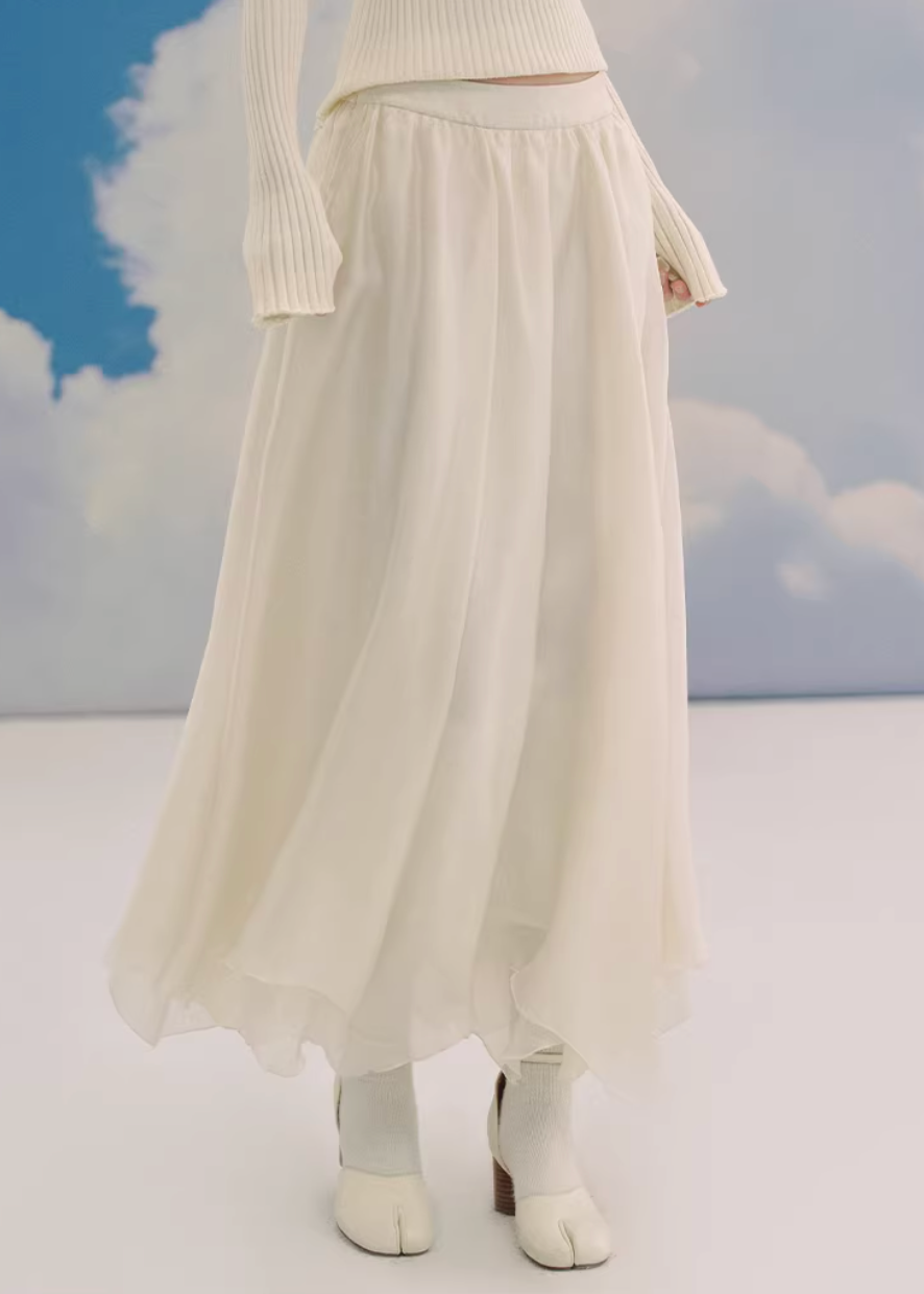 sheer maxi skirt, chiffon skirt women, irregular hem skirt, korean fashion skirt, flowy long skirt, a line maxi skirt, elastic waist skirt, feminine chiffon skirt, spring long skirt, elegant ivory skirt, layered sheer skirt, romantic outfit skirt, soft aesthetic fashion, lightweight summer skirt, parisian style skirt, modern feminine clothing, versatile long skirt, airy fabric skirt, graceful movement skirt, refined casual elegance