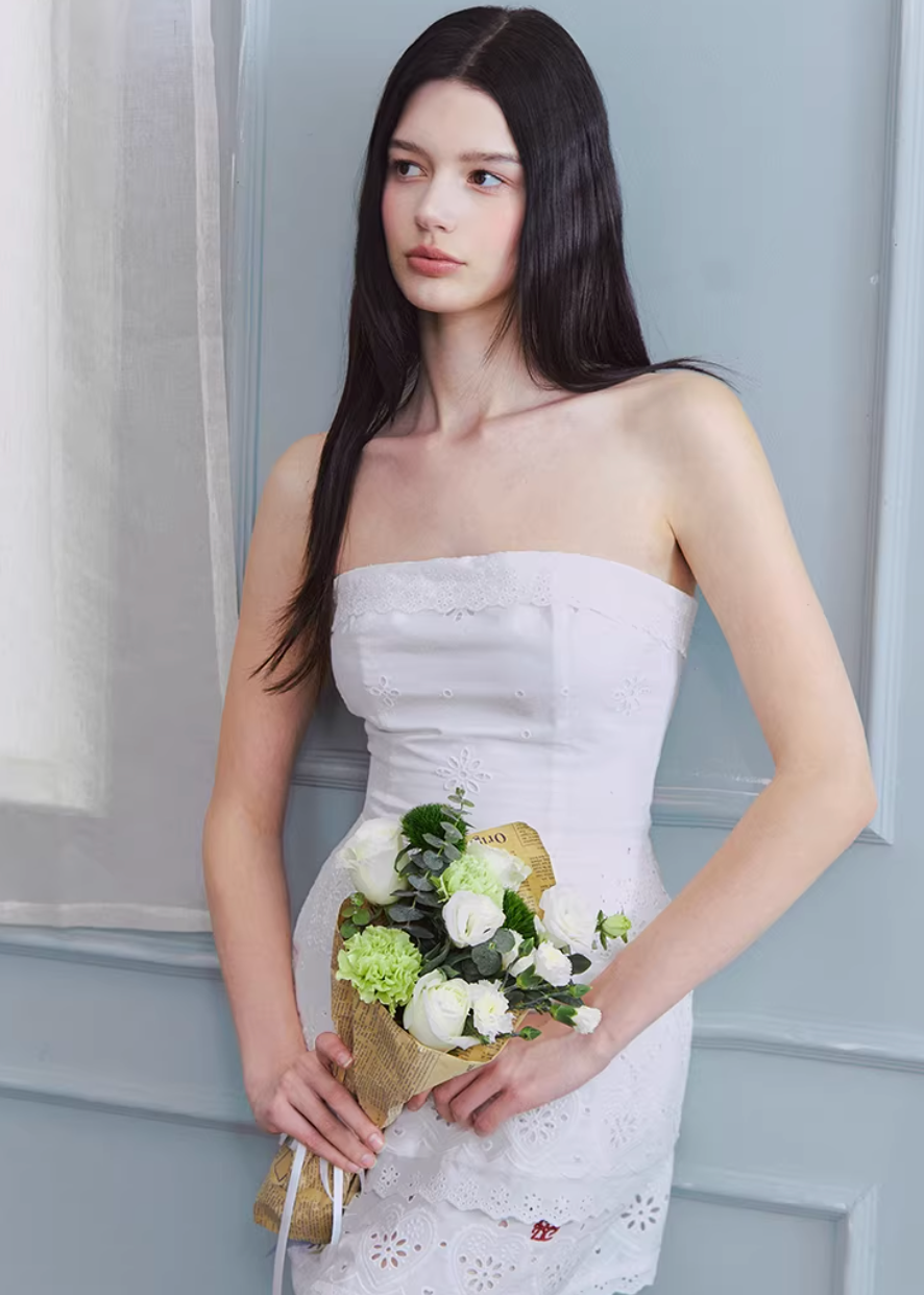 strapless white dress, bandeau mini dress, embroidered white dress, korean fashion dress, ivory mini dress, minimalist strapless dress, fitted mini dress women, elegant summer dress, non slip bandeau dress, clean silhouette dress, feminine white outfit, chic mini dress, parisian style dress, refined minimal dress, spring summer dress women, aesthetic fashion dress, modern feminine clothing, versatile party dress, soft elegant dress, statement white dress