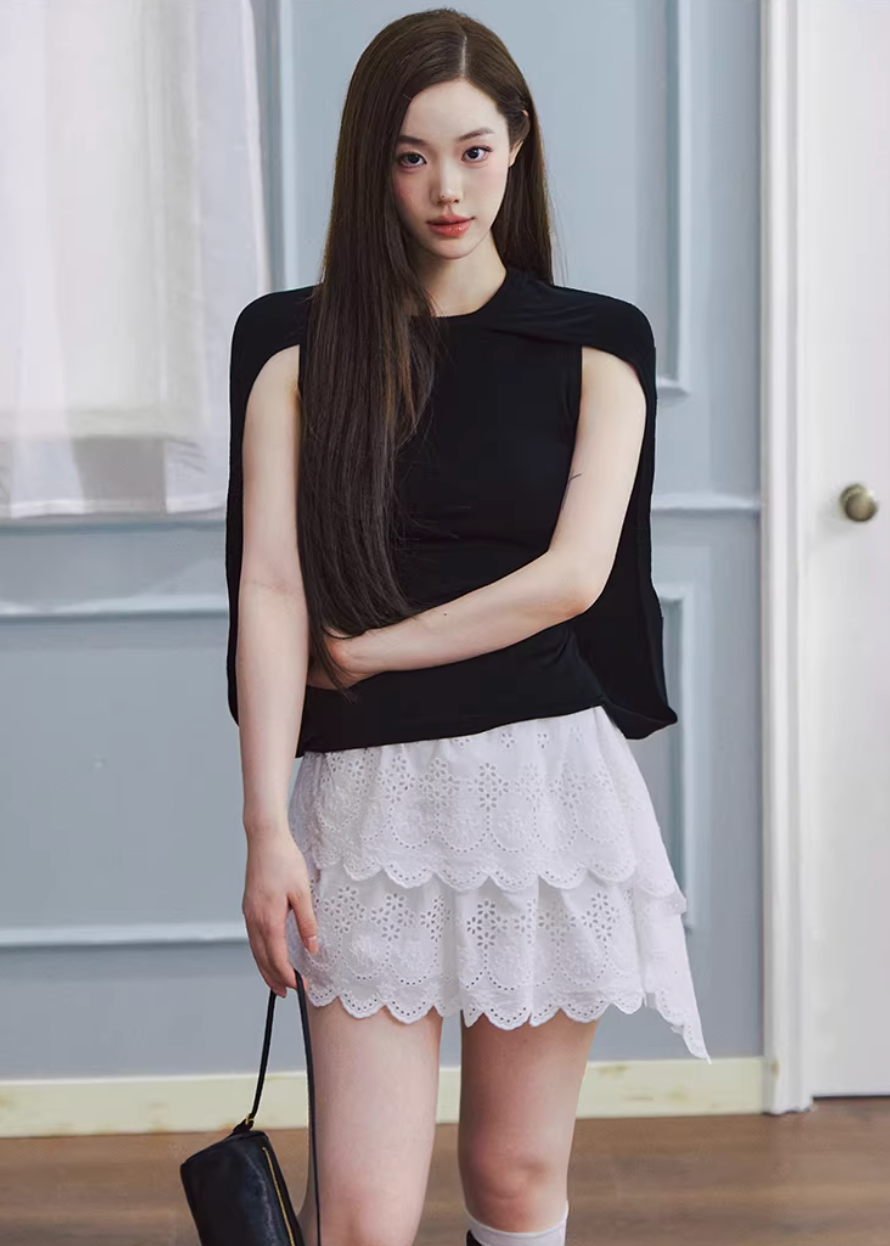 lyocell knit top, cape style top women, sleeveless knit top, korean fashion top, minimalist summer top, draped knit top, lightweight knitwear, breathable fabric top, modern feminine clothing, casual elegant top, soft knit blouse, parisian style clothing, versatile summer outfit, aesthetic fashion top, refined casual wear, clean line top women, flowy knit top, chic everyday top, simple design top, comfortable summer knit