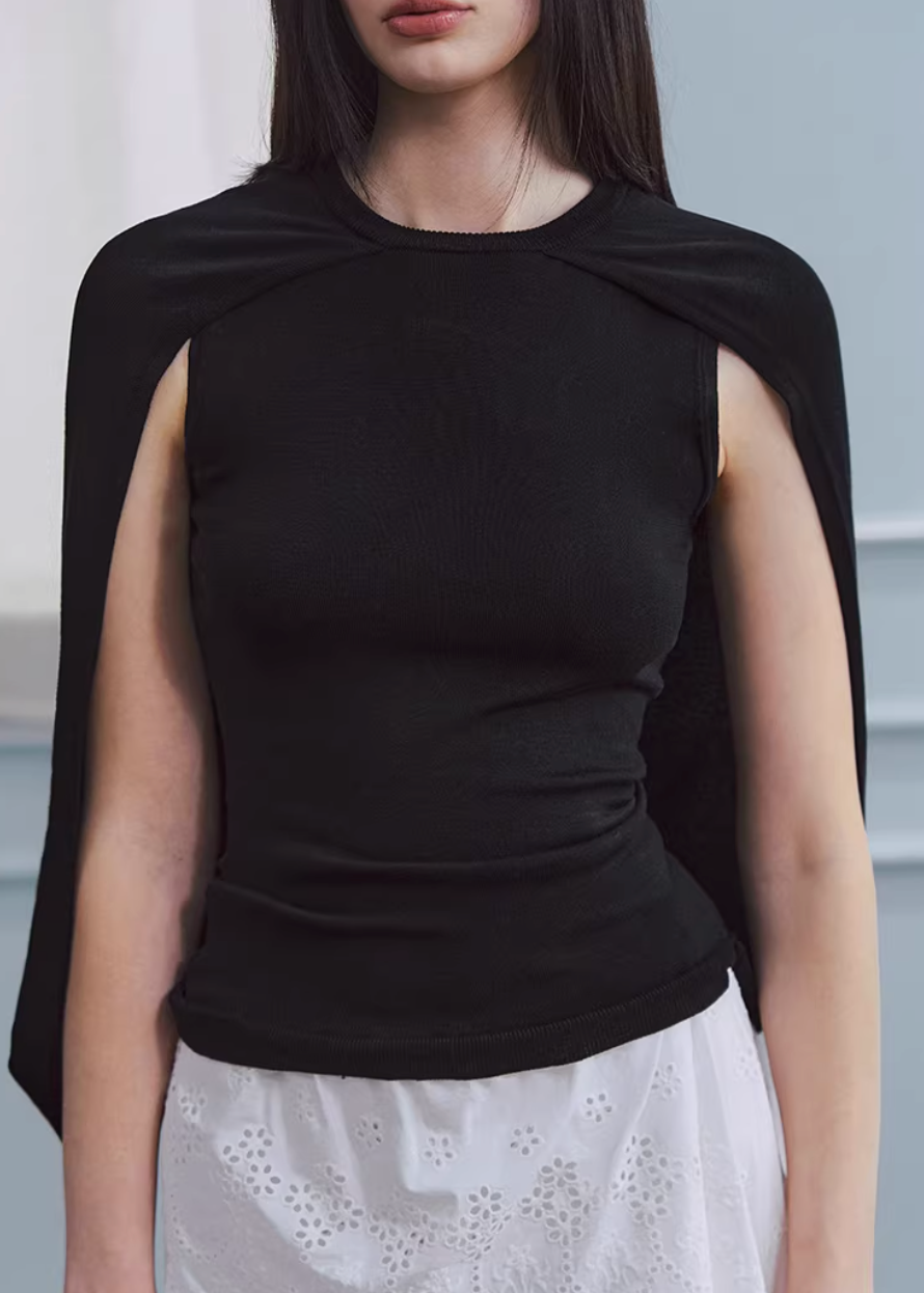 lyocell knit top, cape style top women, sleeveless knit top, korean fashion top, minimalist summer top, draped knit top, lightweight knitwear, breathable fabric top, modern feminine clothing, casual elegant top, soft knit blouse, parisian style clothing, versatile summer outfit, aesthetic fashion top, refined casual wear, clean line top women, flowy knit top, chic everyday top, simple design top, comfortable summer knit