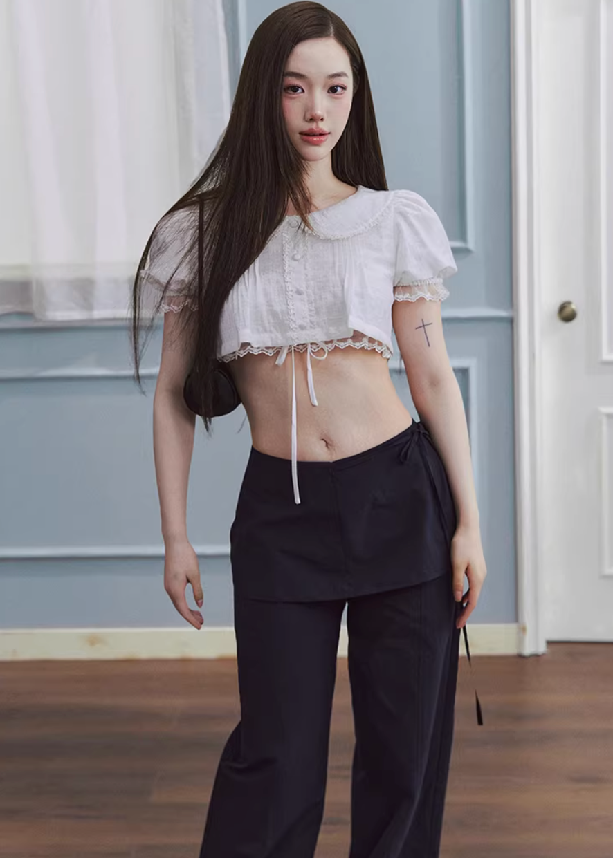 cropped lace blouse women, doll collar top, lace trim blouse, korean fashion top, drawstring blouse women, feminine spring top, lightweight summer blouse, soft girl aesthetic top, white cropped shirt, breathable cotton top, casual romantic blouse, aesthetic fashion top, parisian style clothing, versatile crop top, modern feminine clothing, delicate lace top, chic everyday outfit, airy fabric blouse, youthful style top, spring outfit women