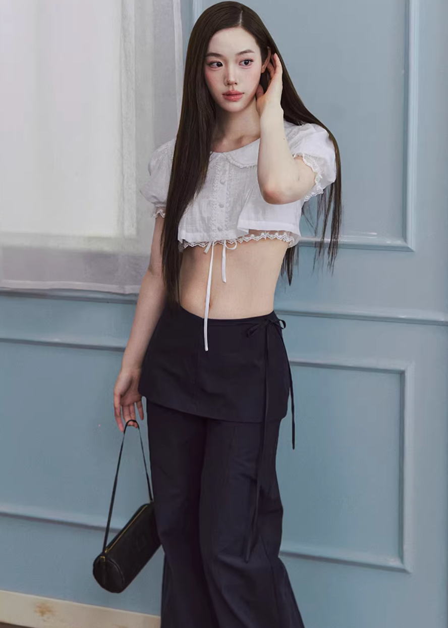 cropped lace blouse women, doll collar top, lace trim blouse, korean fashion top, drawstring blouse women, feminine spring top, lightweight summer blouse, soft girl aesthetic top, white cropped shirt, breathable cotton top, casual romantic blouse, aesthetic fashion top, parisian style clothing, versatile crop top, modern feminine clothing, delicate lace top, chic everyday outfit, airy fabric blouse, youthful style top, spring outfit women