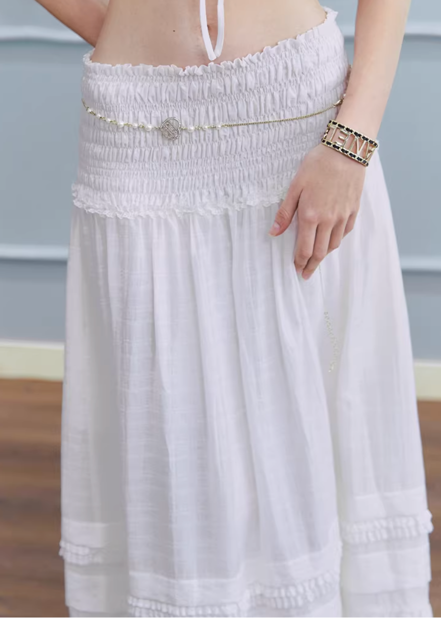 white maxi skirt, pleated long skirt, korean fashion skirt, flowy maxi skirt, elastic waist skirt, feminine long skirt, spring summer skirt, lightweight skirt women, elegant casual outfit, parisian style clothing, soft aesthetic skirt, tiered maxi skirt, breathable fabric skirt, modern feminine clothing, versatile long skirt, chic everyday outfit, refined casual wear, airy fabric skirt, graceful silhouette skirt, minimal elegant skirt
