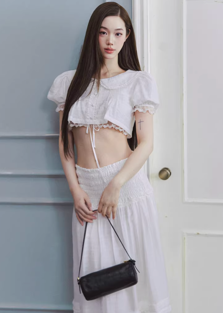 white maxi skirt, pleated long skirt, korean fashion skirt, flowy maxi skirt, elastic waist skirt, feminine long skirt, spring summer skirt, lightweight skirt women, elegant casual outfit, parisian style clothing, soft aesthetic skirt, tiered maxi skirt, breathable fabric skirt, modern feminine clothing, versatile long skirt, chic everyday outfit, refined casual wear, airy fabric skirt, graceful silhouette skirt, minimal elegant skirt