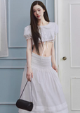white maxi skirt, pleated long skirt, korean fashion skirt, flowy maxi skirt, elastic waist skirt, feminine long skirt, spring summer skirt, lightweight skirt women, elegant casual outfit, parisian style clothing, soft aesthetic skirt, tiered maxi skirt, breathable fabric skirt, modern feminine clothing, versatile long skirt, chic everyday outfit, refined casual wear, airy fabric skirt, graceful silhouette skirt, minimal elegant skirt