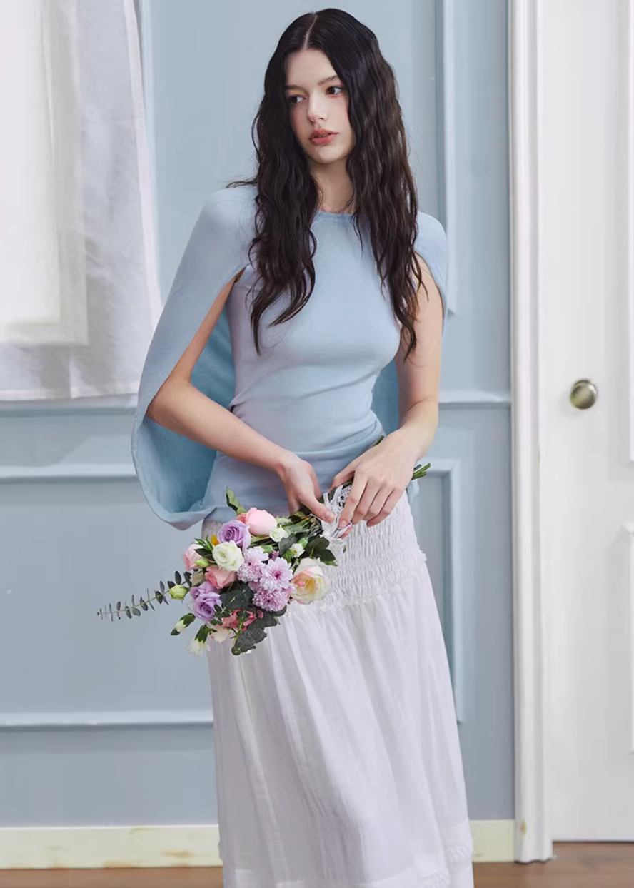 white maxi skirt, pleated long skirt, korean fashion skirt, flowy maxi skirt, elastic waist skirt, feminine long skirt, spring summer skirt, lightweight skirt women, elegant casual outfit, parisian style clothing, soft aesthetic skirt, tiered maxi skirt, breathable fabric skirt, modern feminine clothing, versatile long skirt, chic everyday outfit, refined casual wear, airy fabric skirt, graceful silhouette skirt, minimal elegant skirt