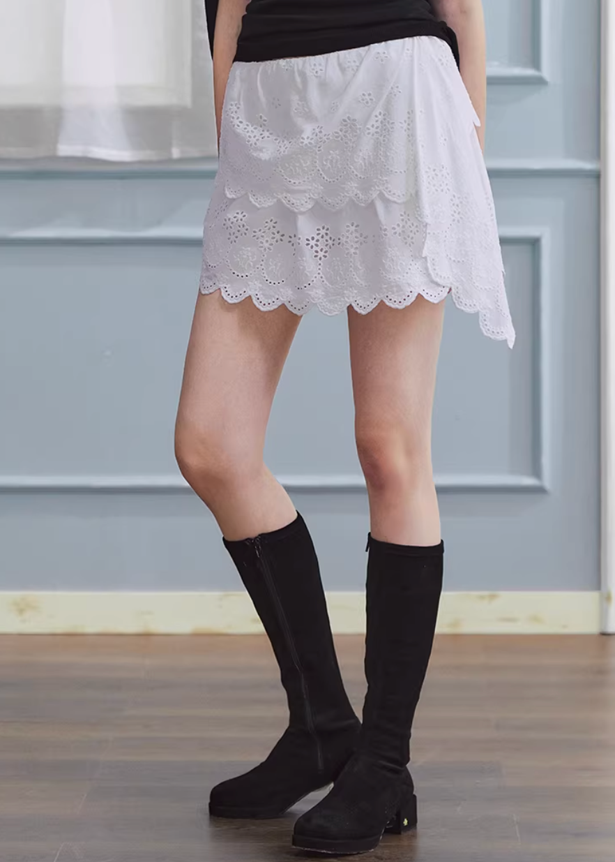 white embroidered skirt, a line mini skirt, cut out lace skirt, korean fashion skirt, spring outfits 2026, feminine mini skirt, asymmetrical skirt women, cotton skirt women, lightweight summer skirt, aesthetic fashion skirt, chic everyday outfit, modern feminine clothing, versatile white skirt, parisian style clothing, refined casual wear, delicate lace skirt, soft girl aesthetic outfit, breathable cotton skirt, elegant mini skirt, spring wardrobe essential