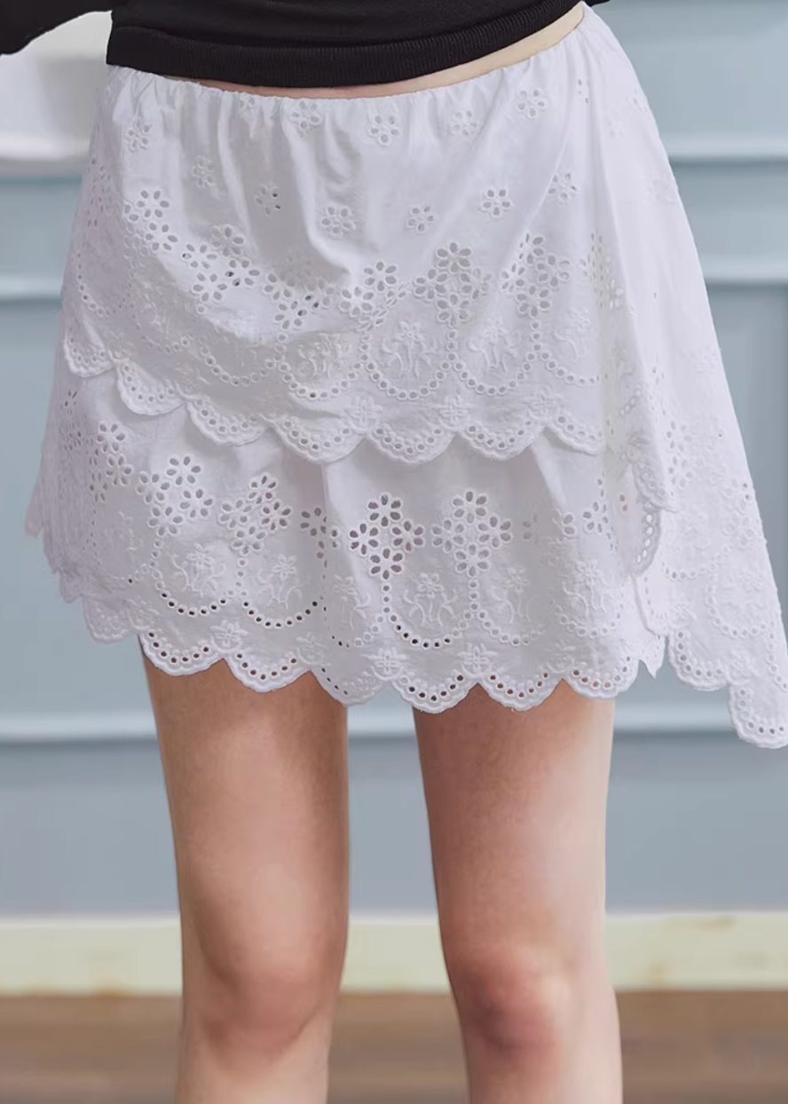 white embroidered skirt, a line mini skirt, cut out lace skirt, korean fashion skirt, spring outfits 2026, feminine mini skirt, asymmetrical skirt women, cotton skirt women, lightweight summer skirt, aesthetic fashion skirt, chic everyday outfit, modern feminine clothing, versatile white skirt, parisian style clothing, refined casual wear, delicate lace skirt, soft girl aesthetic outfit, breathable cotton skirt, elegant mini skirt, spring wardrobe essential