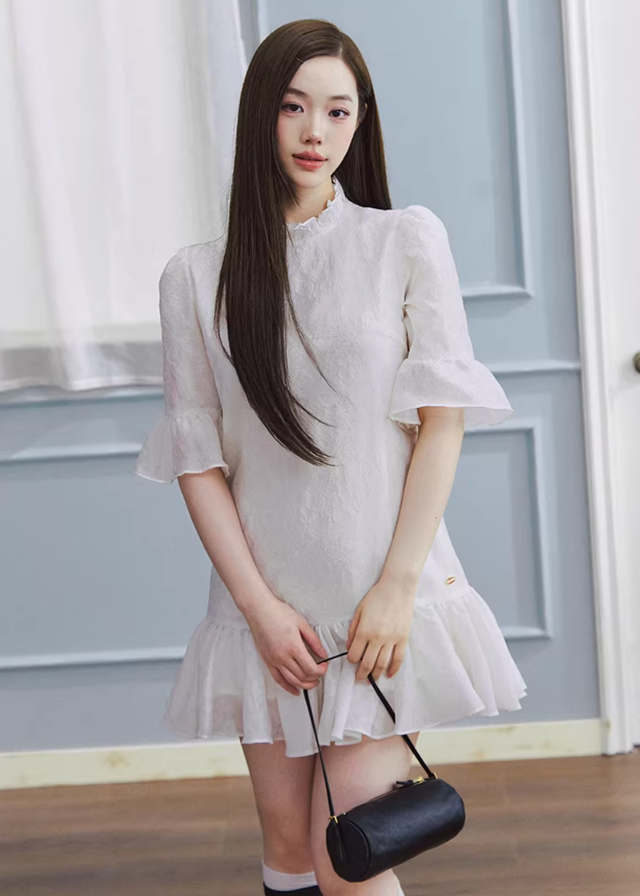 white mini dress women, jacquard dress women, ruffle dress spring, korean fashion dress, spring outfits 2026, feminine mini dress, textured white dress, aesthetic fashion dress, lightweight summer dress, chic everyday outfit, modern feminine clothing, elegant casual dress, parisian style clothing, versatile spring dress, soft girl aesthetic dress, flared mini dress, refined casual wear, delicate texture dress, romantic white dress, spring wardrobe essential