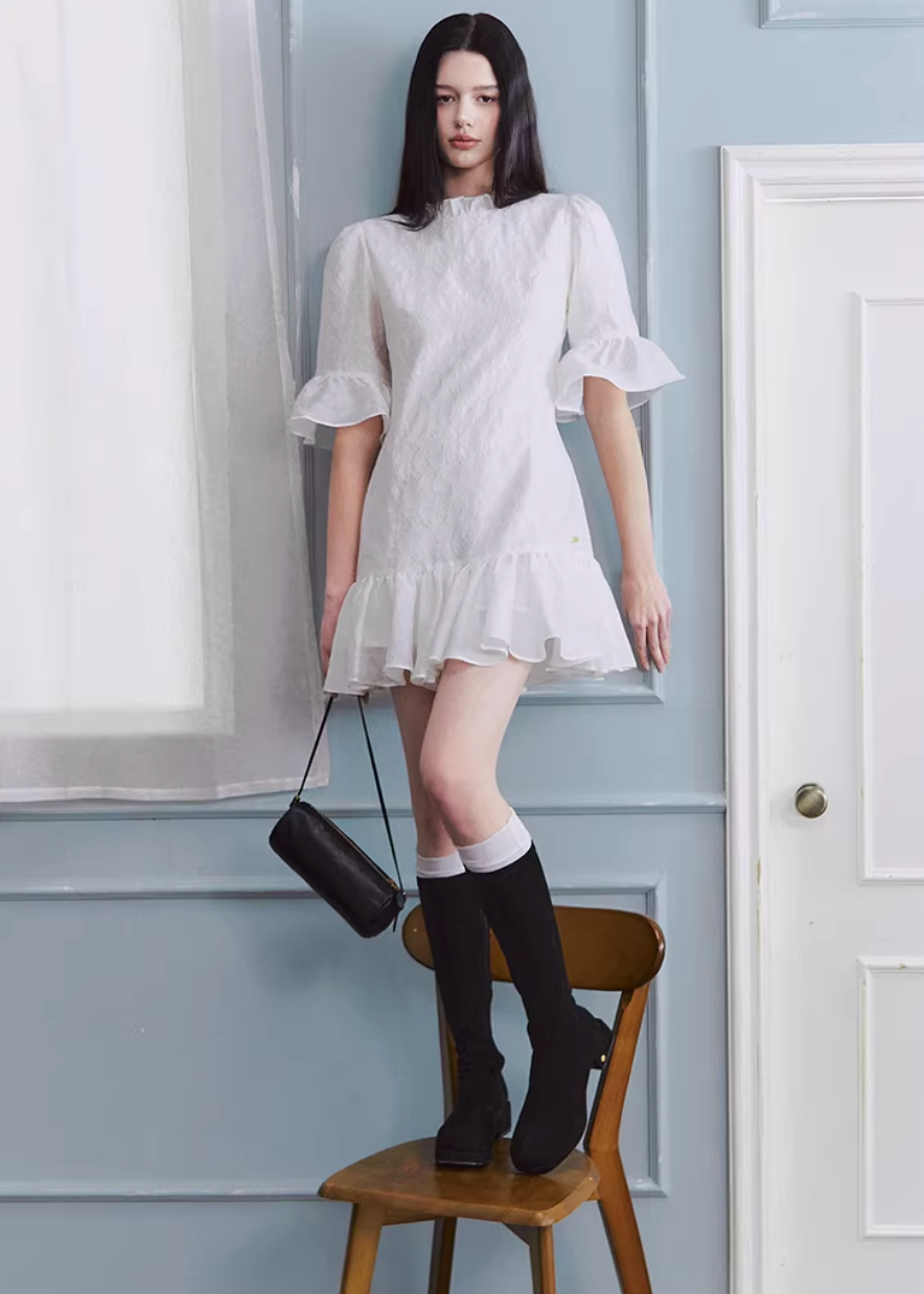 white mini dress women, jacquard dress women, ruffle dress spring, korean fashion dress, spring outfits 2026, feminine mini dress, textured white dress, aesthetic fashion dress, lightweight summer dress, chic everyday outfit, modern feminine clothing, elegant casual dress, parisian style clothing, versatile spring dress, soft girl aesthetic dress, flared mini dress, refined casual wear, delicate texture dress, romantic white dress, spring wardrobe essential