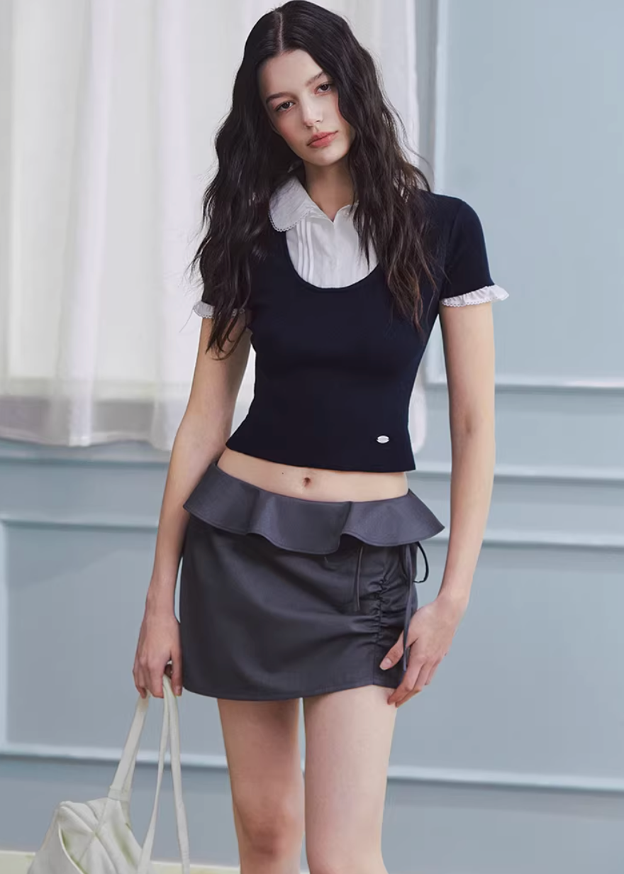 layered knit top women, fake two piece top, shirt collar knit, korean fashion top, spring outfit ideas, slim fit knit top, short sleeve knit women, feminine casual top, lightweight knitwear, aesthetic fashion top, modern feminine clothing, versatile everyday top, parisian style clothing, fitted knit blouse, clean line top, refined casual wear, minimal style top, chic everyday outfit, spring wardrobe essential, contrast collar top