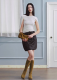 leather mini skirt women, black leather skirt, korean fashion skirt, spring outfits 2026, casual spring outfits, vintage leather skirt, structured mini skirt, aesthetic fashion skirt, modern feminine clothing, chic street style skirt, versatile mini skirt, edgy outfit women, refined casual wear, parisian style clothing, fitted leather skirt, clean silhouette skirt, stylish short skirt, contemporary fashion women, statement skirt women, essential wardrobe piece