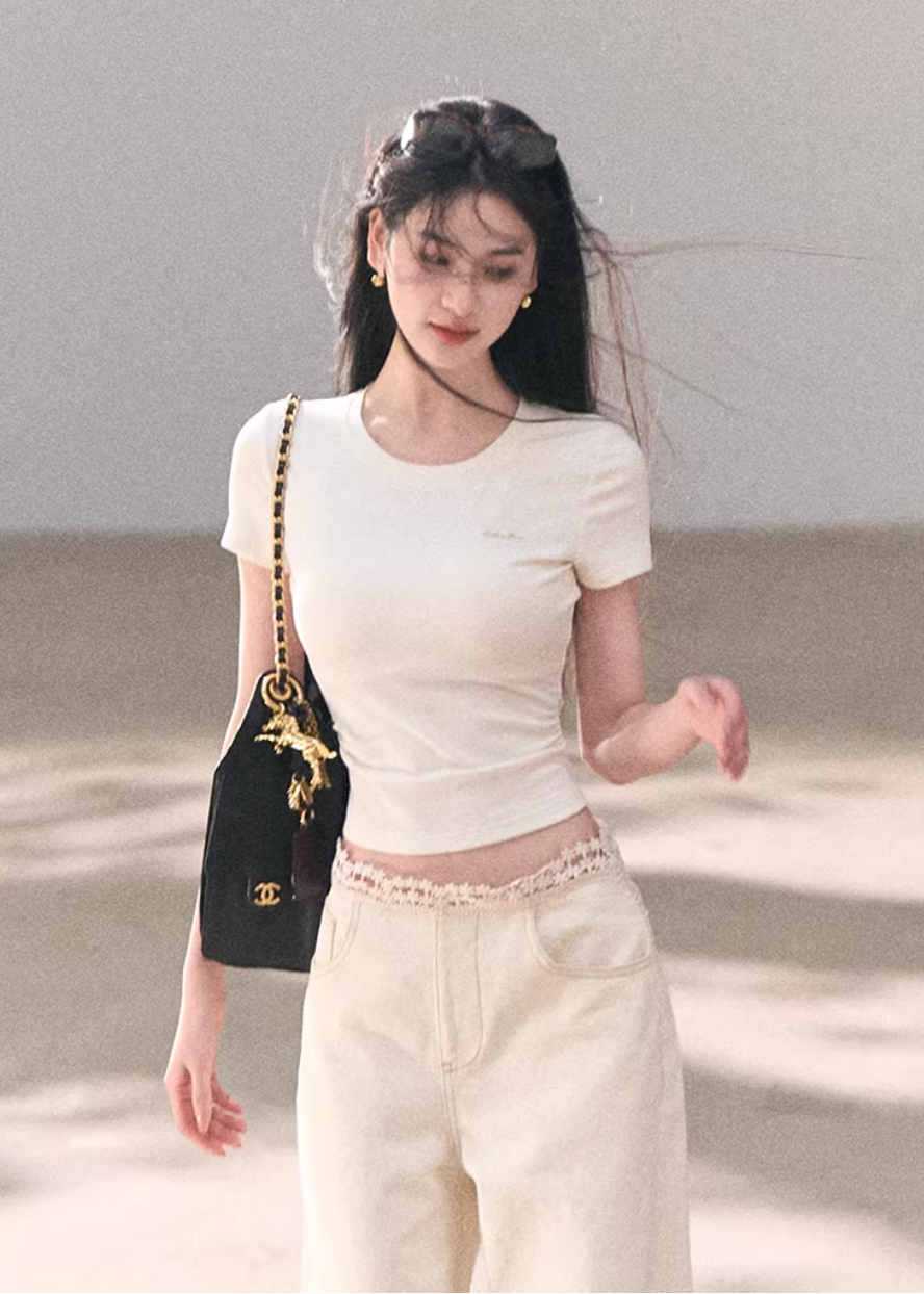 crew neck t shirt women, embroidered logo tee, korean fashion top, spring outfits 2026, casual spring outfits, slim fit t shirt women, minimalist t shirt women, basic essential top, breathable cotton tee, soft aesthetic outfit, modern feminine clothing, parisian style clothing, versatile everyday top, chic casual outfit, clean line t shirt, refined casual wear, simple design top, spring wardrobe essential, fitted t shirt women, effortless style top