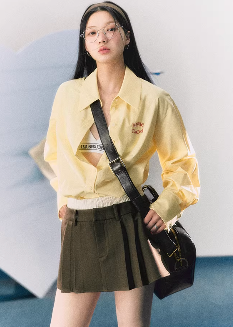 lapel shirt women, embroidered logo shirt, korean fashion top, spring brunch outfit, brunch outfit ideas, summer outfit ideas, college style shirt women, loose fit blouse women, aesthetic fashion top, modern feminine clothing, parisian style clothing, versatile everyday top, chic casual outfit, lightweight summer shirt, preppy style outfit, effortless style blouse, spring wardrobe essential, minimal style shirt, casual chic top, feminine outfit top