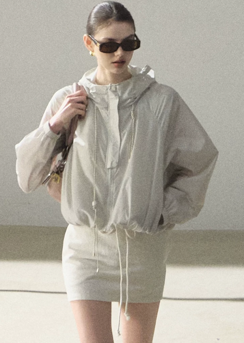 hooded jacket women, sunscreen jacket women, korean fashion outerwear, minimal outfit women, effortless outfit ideas, casual summer outfits, uv protection clothing, lightweight jacket women, modern feminine clothing, parisian style clothing, versatile outerwear women, chic casual outfit, breathable summer jacket, travel outfit women, relaxed fit jacket women, everyday layering jacket, clean silhouette jacket, simple functional clothing, summer wardrobe jacket, outdoor casual outfit

