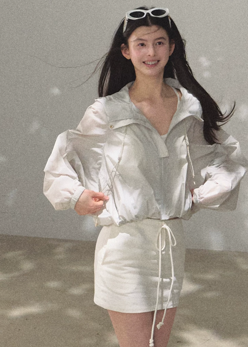 hooded jacket women, sunscreen jacket women, korean fashion outerwear, minimal outfit women, effortless outfit ideas, casual summer outfits, uv protection clothing, lightweight jacket women, modern feminine clothing, parisian style clothing, versatile outerwear women, chic casual outfit, breathable summer jacket, travel outfit women, relaxed fit jacket women, everyday layering jacket, clean silhouette jacket, simple functional clothing, summer wardrobe jacket, outdoor casual outfit

