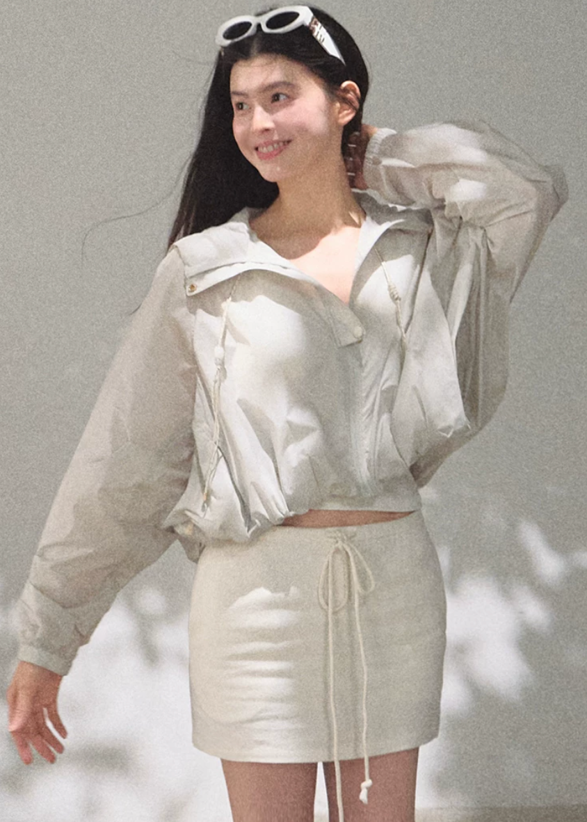 hooded jacket women, sunscreen jacket women, korean fashion outerwear, minimal outfit women, effortless outfit ideas, casual summer outfits, uv protection clothing, lightweight jacket women, modern feminine clothing, parisian style clothing, versatile outerwear women, chic casual outfit, breathable summer jacket, travel outfit women, relaxed fit jacket women, everyday layering jacket, clean silhouette jacket, simple functional clothing, summer wardrobe jacket, outdoor casual outfit

