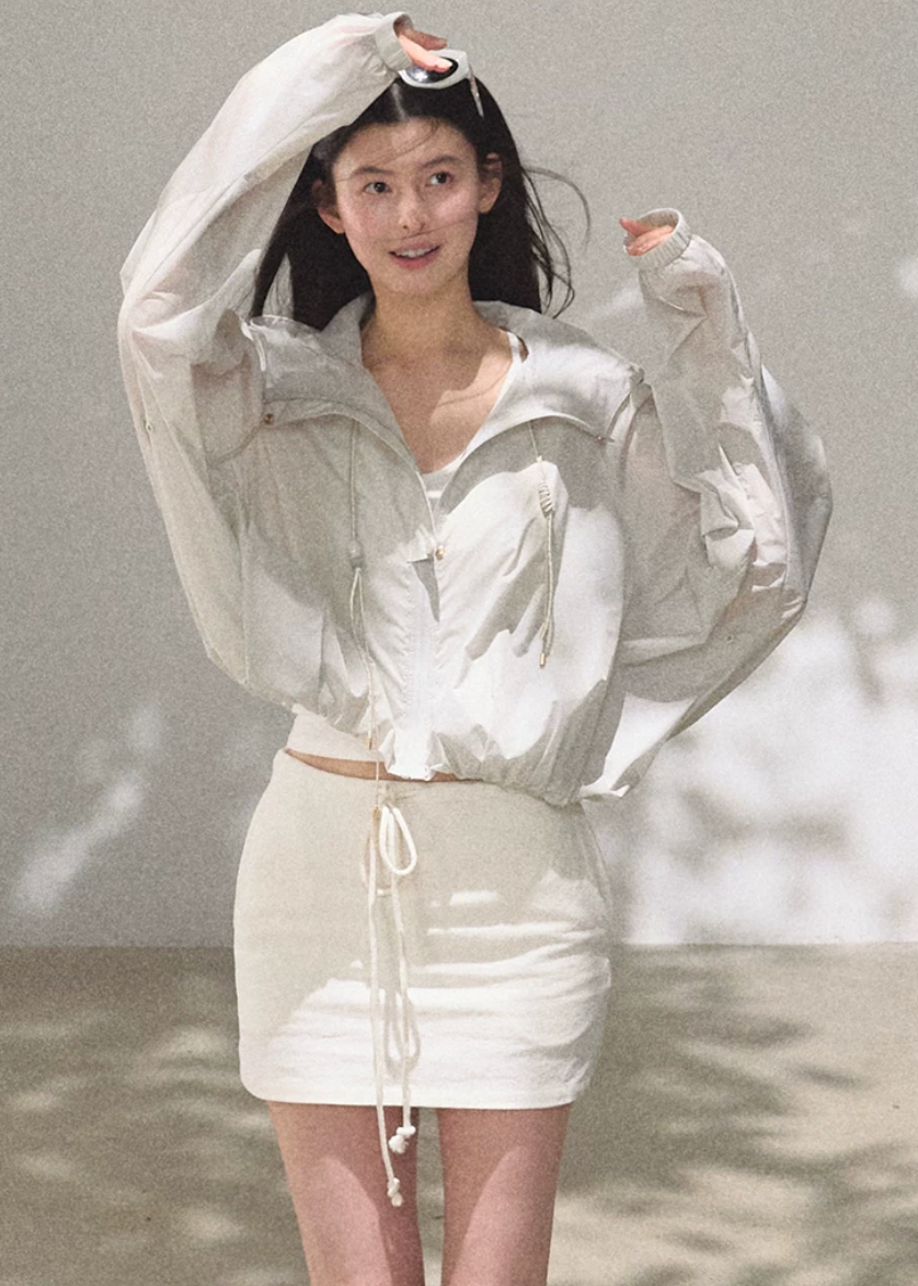 hooded jacket women, sunscreen jacket women, korean fashion outerwear, minimal outfit women, effortless outfit ideas, casual summer outfits, uv protection clothing, lightweight jacket women, modern feminine clothing, parisian style clothing, versatile outerwear women, chic casual outfit, breathable summer jacket, travel outfit women, relaxed fit jacket women, everyday layering jacket, clean silhouette jacket, simple functional clothing, summer wardrobe jacket, outdoor casual outfit

