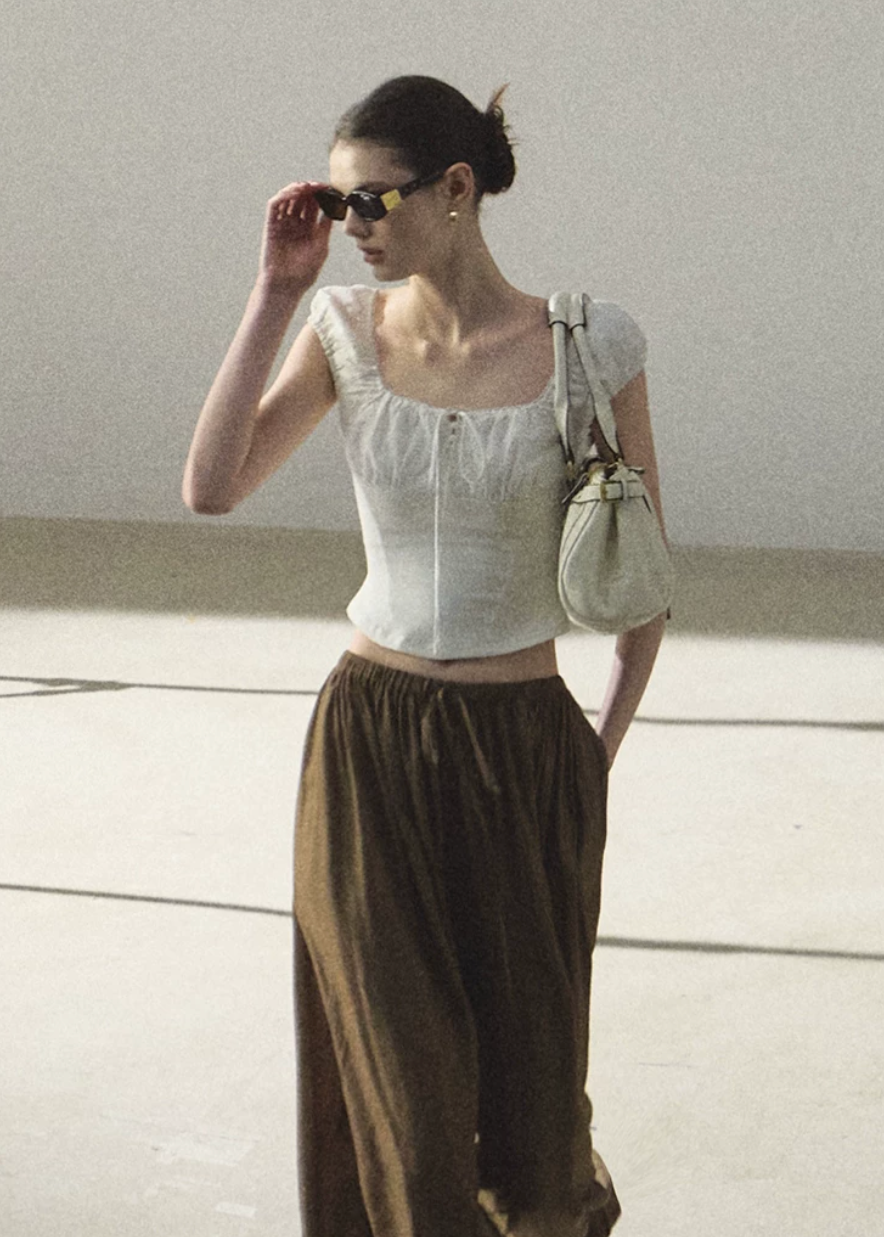 puff sleeve top women, slim fit t shirt women, korean fashion top, minimal outfit women, effortless outfit ideas, casual summer outfits, short sleeve blouse women, modern feminine clothing, parisian style clothing, versatile everyday top, chic casual outfit, calm luxury fashion, breathable summer top, fitted tee women, simple basic top, clean silhouette top, everyday essential top, refined casual wear, lightweight summer top, minimalist fashion top

